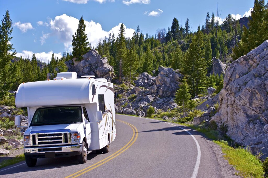 RV camper driving down the road