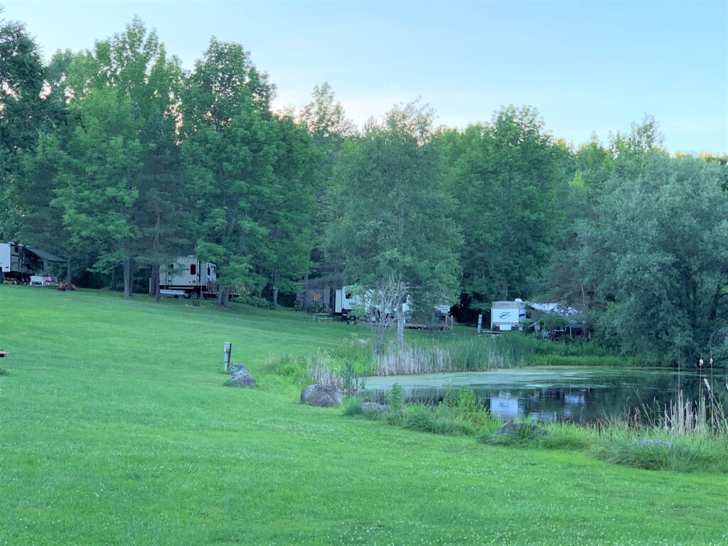 RV sites and pond at Houghton Letchworth KOA