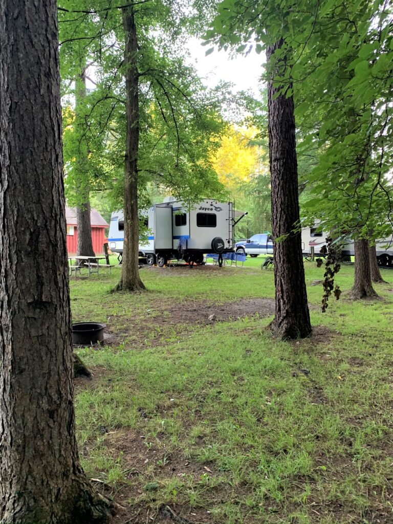 RV site from the wooded trail at the KOA