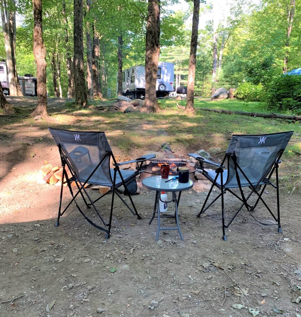 early morning sitting by campfire