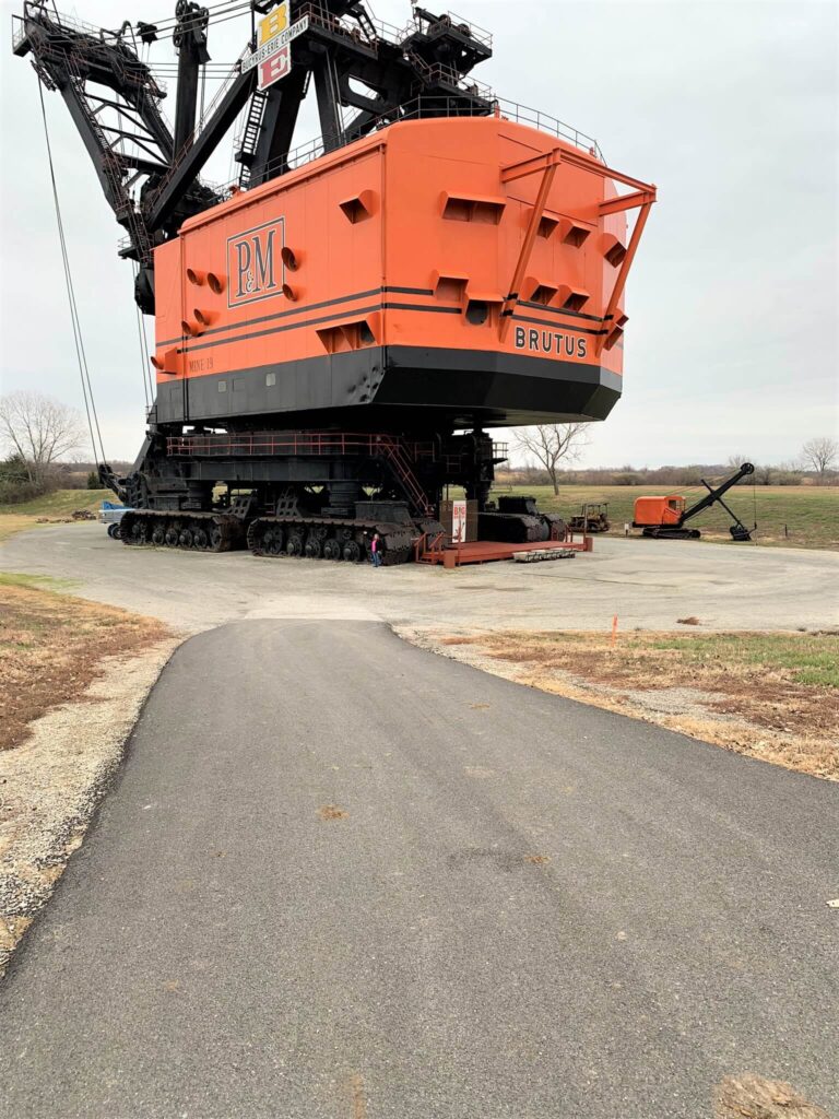 Person Standing Next To Big Brutus